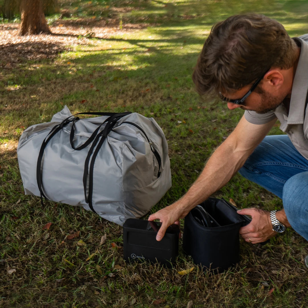 Often Sunday packed into its grey carry duffel with accessory bags, on the grass