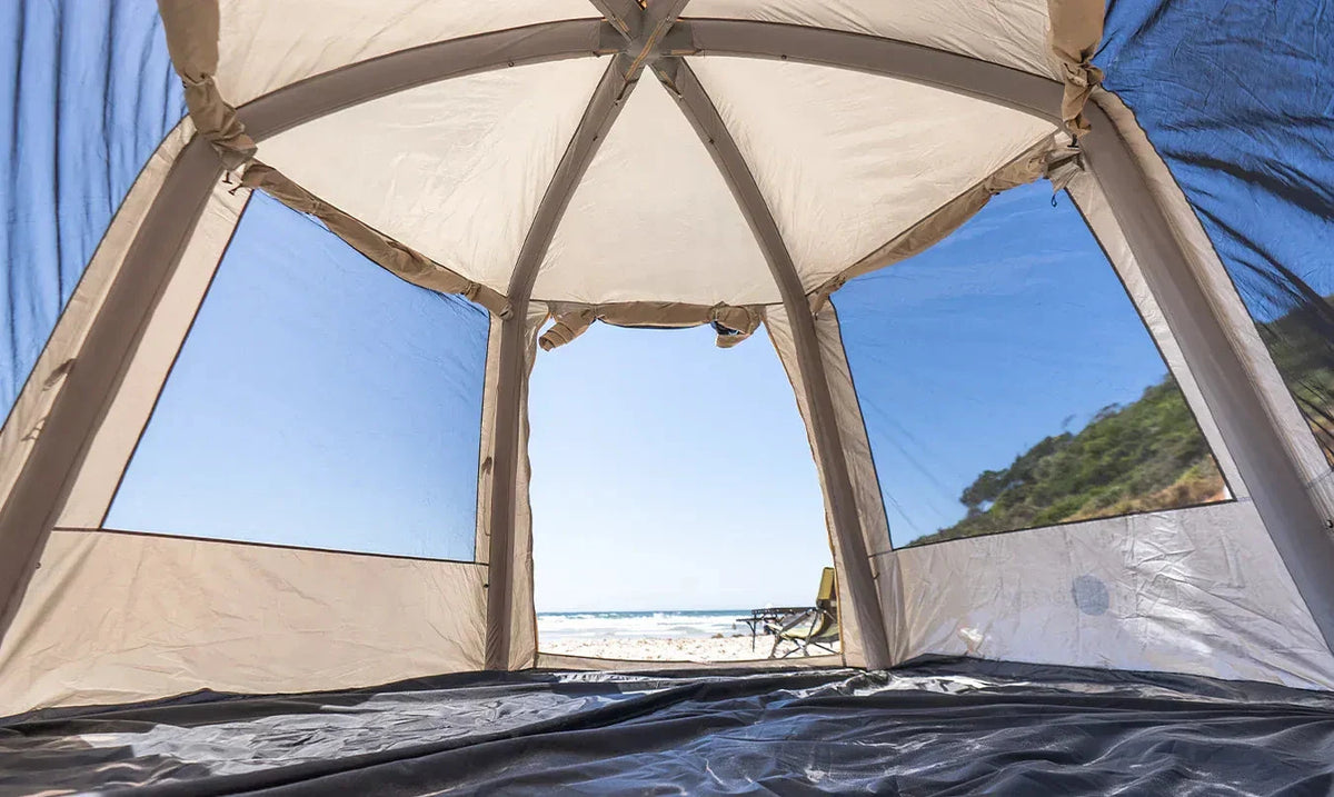 Inside the Often Bunker inflatable tent on a Queensland beach, the air beams running overhead and the floor left clear